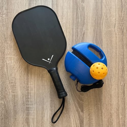 Customer practicing pickleball at home